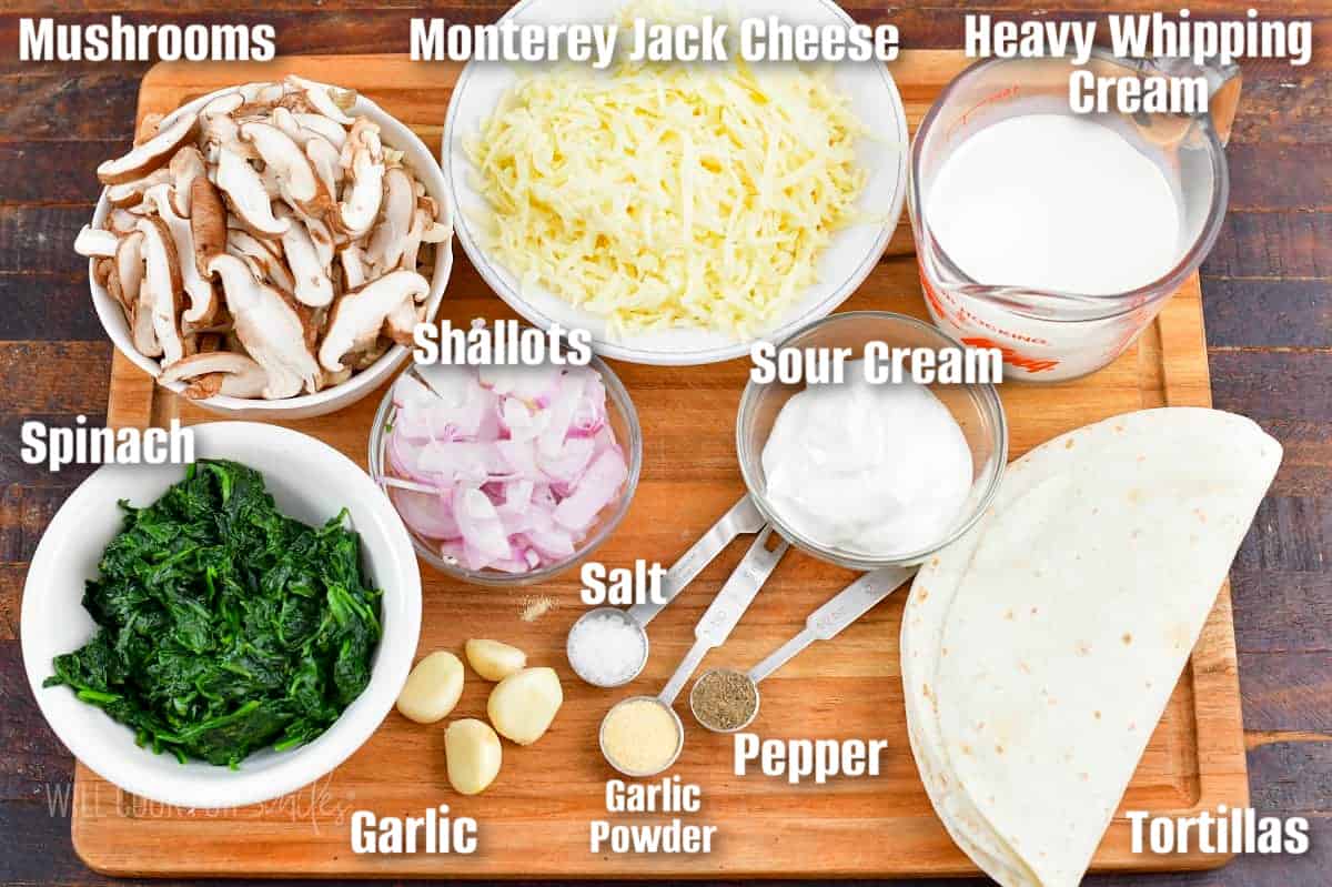labeled ingredients to make vegetarian enchiladas on a cutting board.