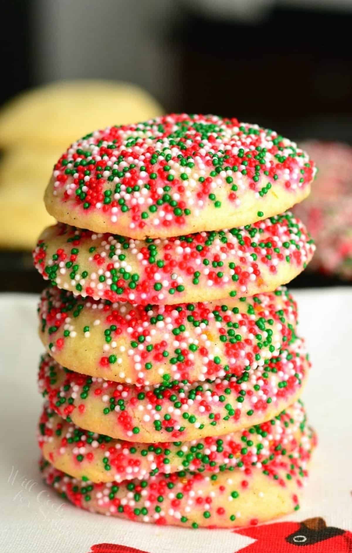 Vanilla bean orange sugar cookies stacked up with spinkles.