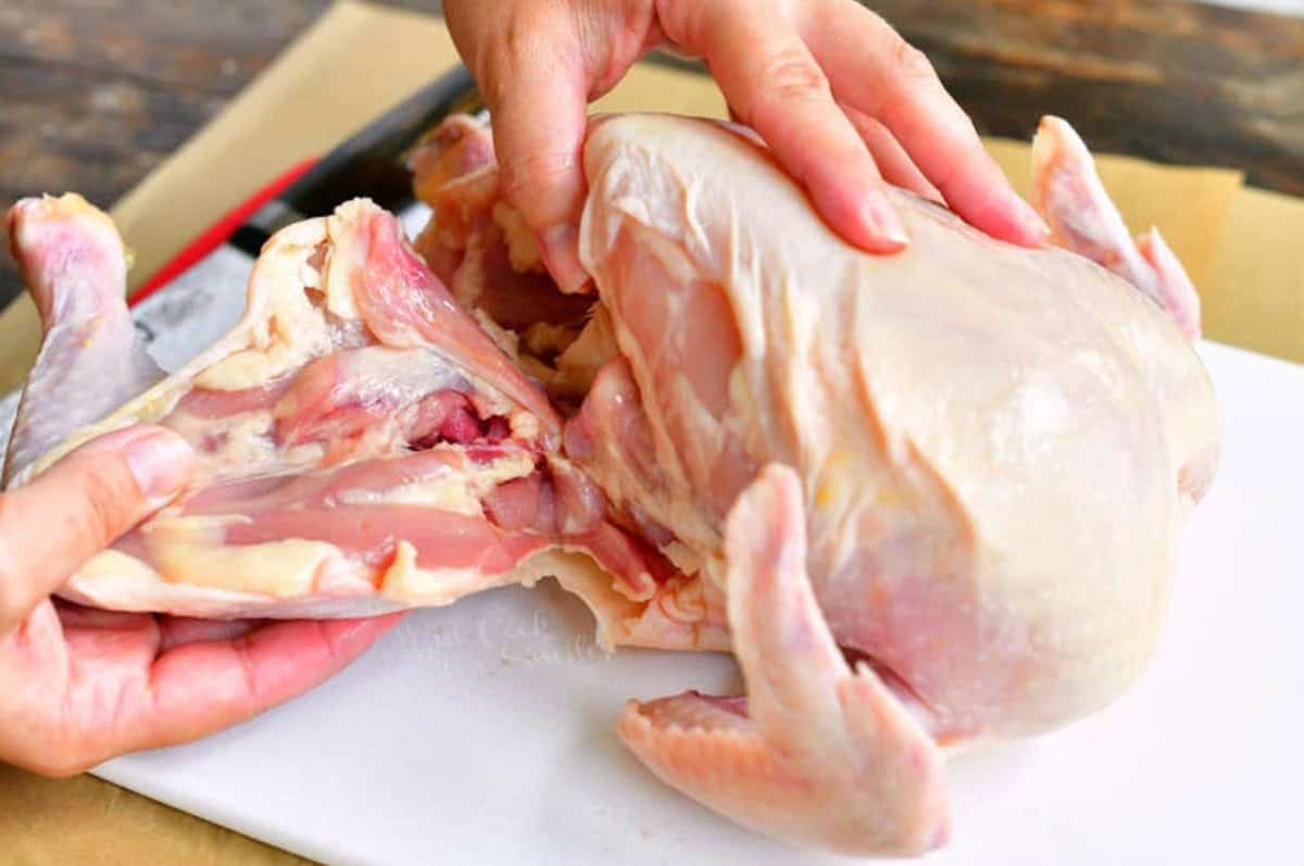 pulling the though off of the whole chicke.