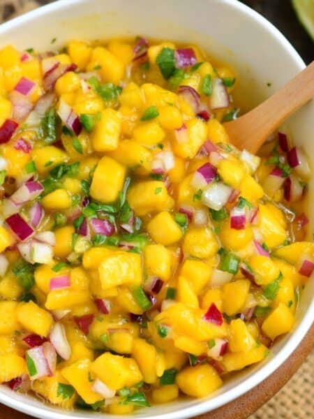 mango salsa with red onion and jalapeno in a bowl.