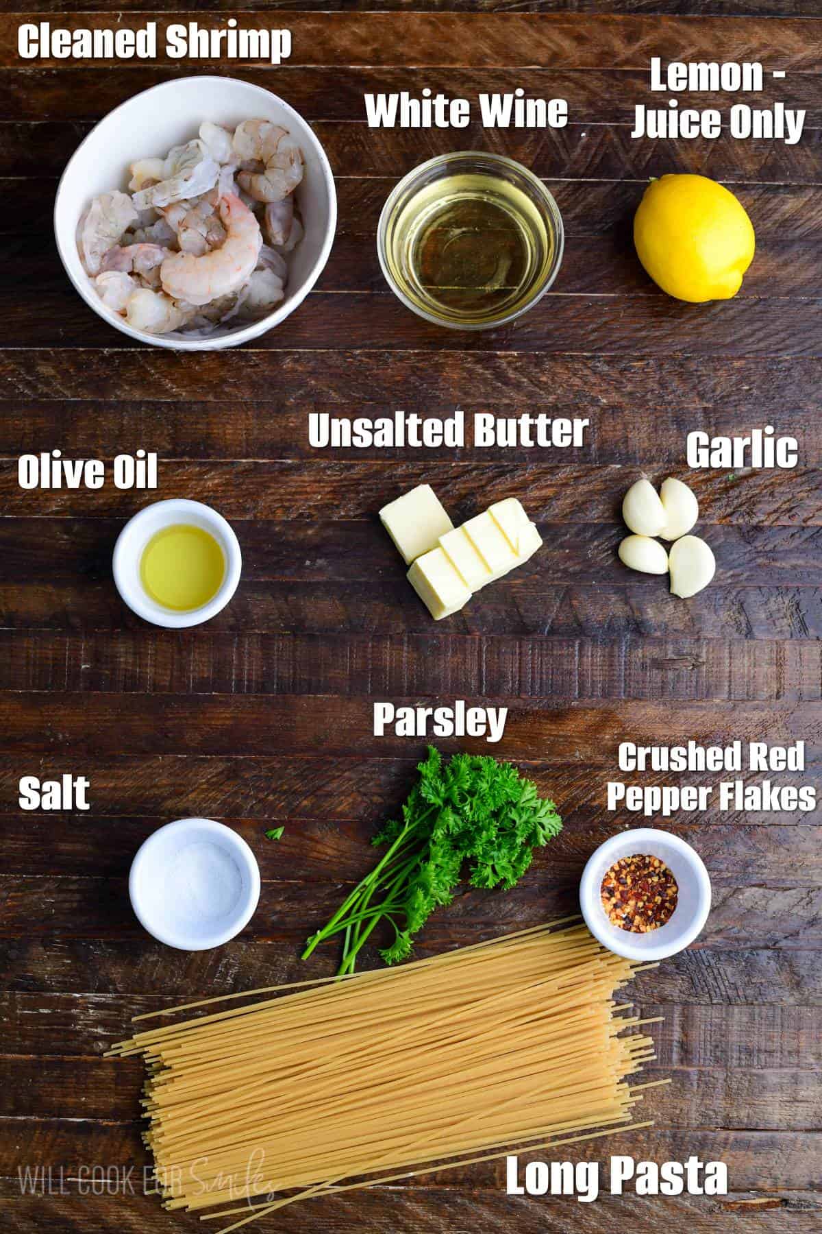 measured shrimp scampi ingredients with labels on wooden board.