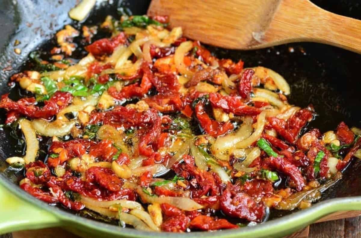 sun dried tomato topping for the baked mahi mahi cooking in the skillet.