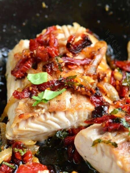 a thick juicy mahi mahi filet pan seared with sun dried tomato and basil topping.