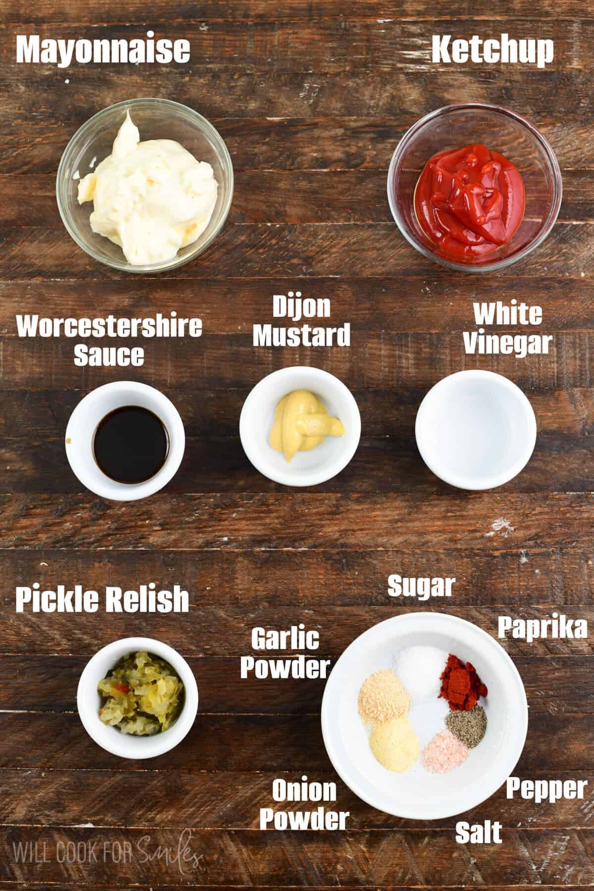 labeled ingredients for burger sauce on a wood surface.
