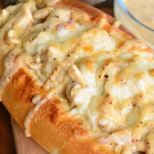 toasted sub sandwich with chicken, and melted cheese, and drizzled with white BBQ sauce.