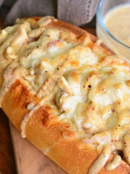 toasted sub sandwich with chicken, and melted cheese, and drizzled with white BBQ sauce.