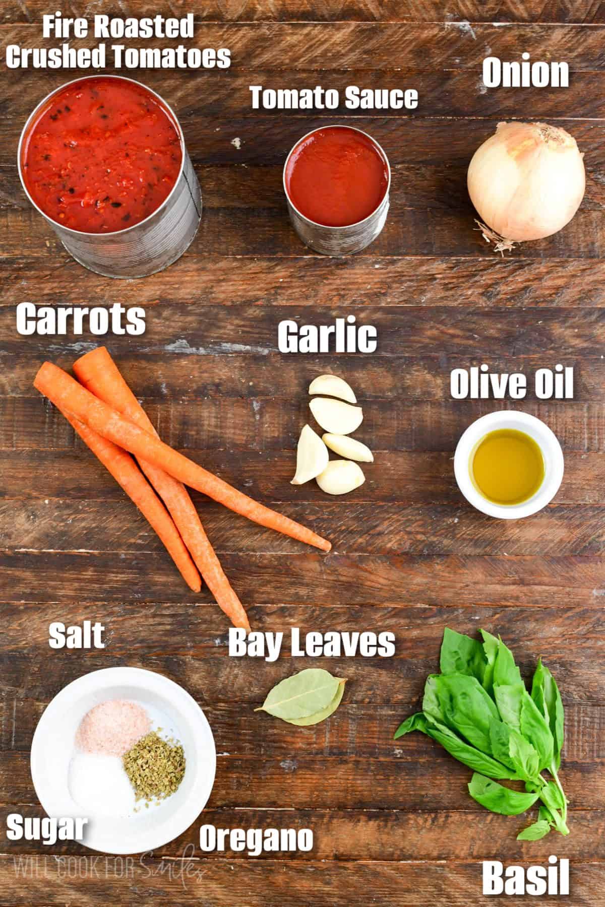 updated labeled ingredients to make tomato spaghetti sauce in a wooden board.