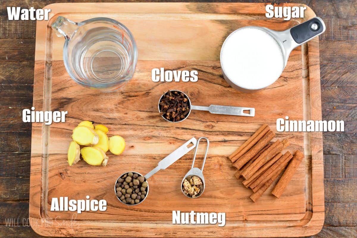 ingredients for pumpkin spiced labeled on a wood cutting board.