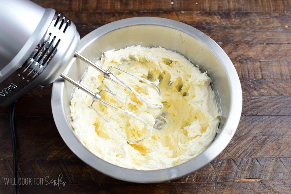 beating the cream cheese mixture until light and fluffy in the mixing bowl.
