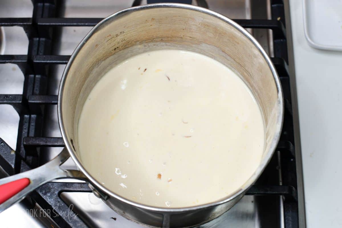 gently simmering the cream sauce for chicken stroganoff.
