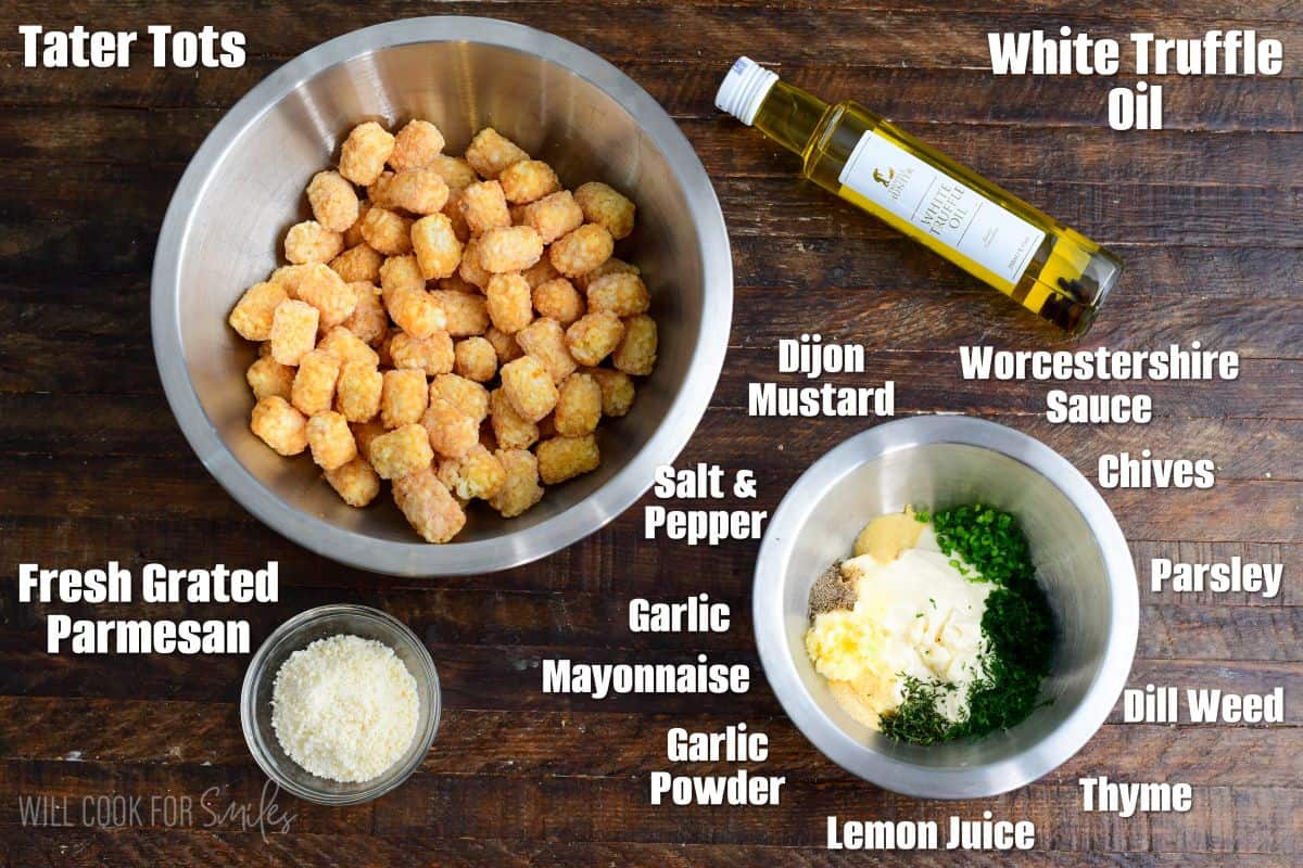Truffle Tater Tots with garlic herb aioli labeled ingredients on a wood surface.