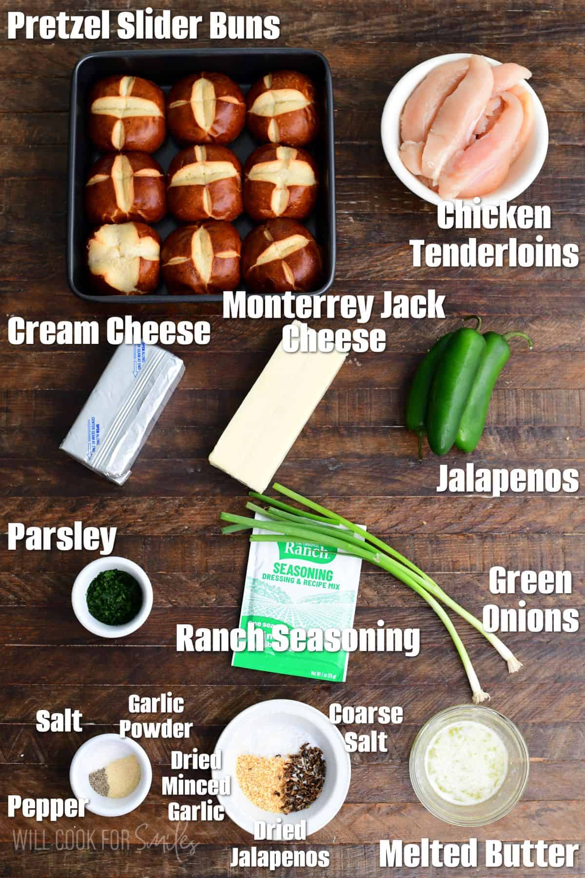 Labeled ingredients for jalapeño ranch chicken sliders on a wood surface.
