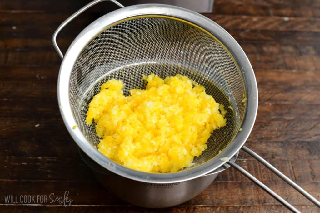 draining the blended vegetables in a fine mesh strainer to squeeze extra liquid.
