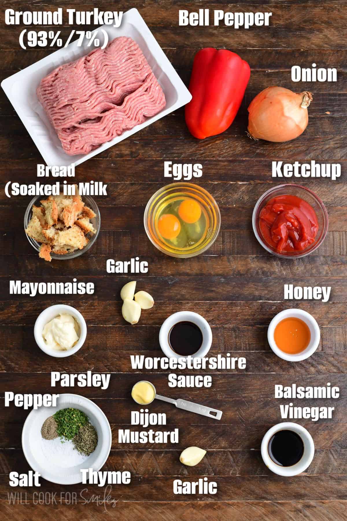 Labeled ingredients for turkey meatloaf on a wood surface.