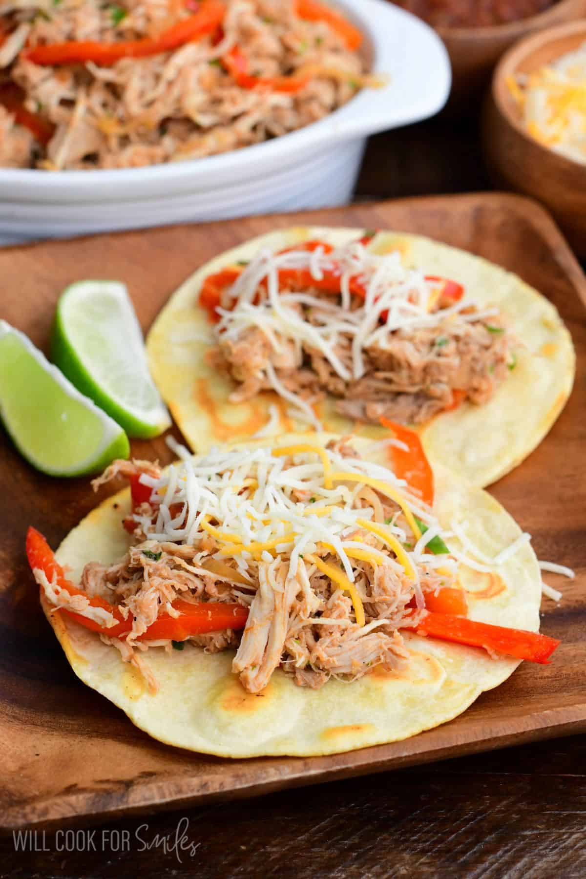 salsa shredded chicken tacos on crispy taco tortilla with some cheese.