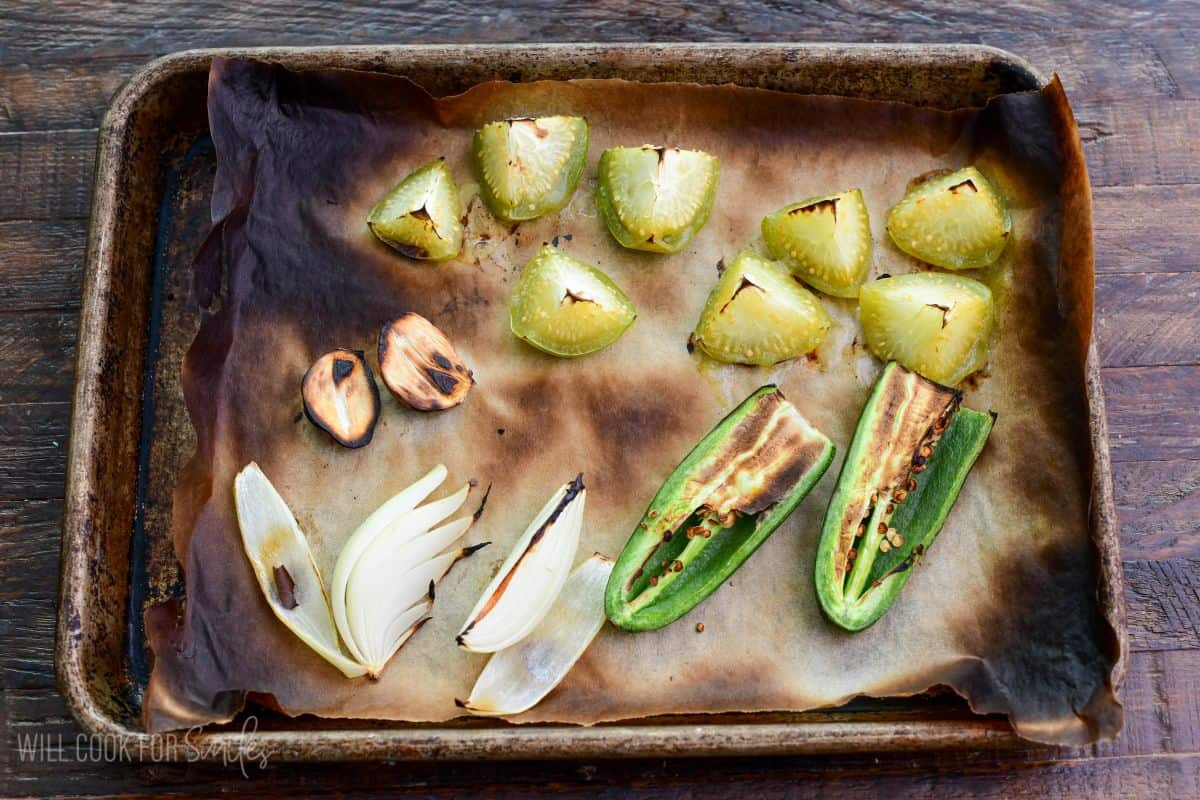 roasted vegetables for Oaxacan guacamole on baking sheet.