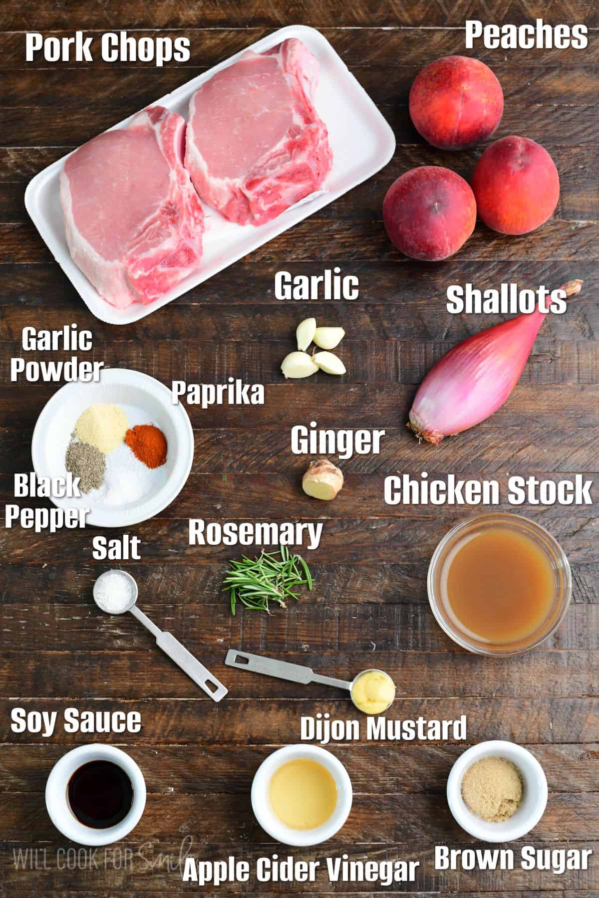 Labeled ingredients for roasted pork chops in peach sauce on a wood surface.
