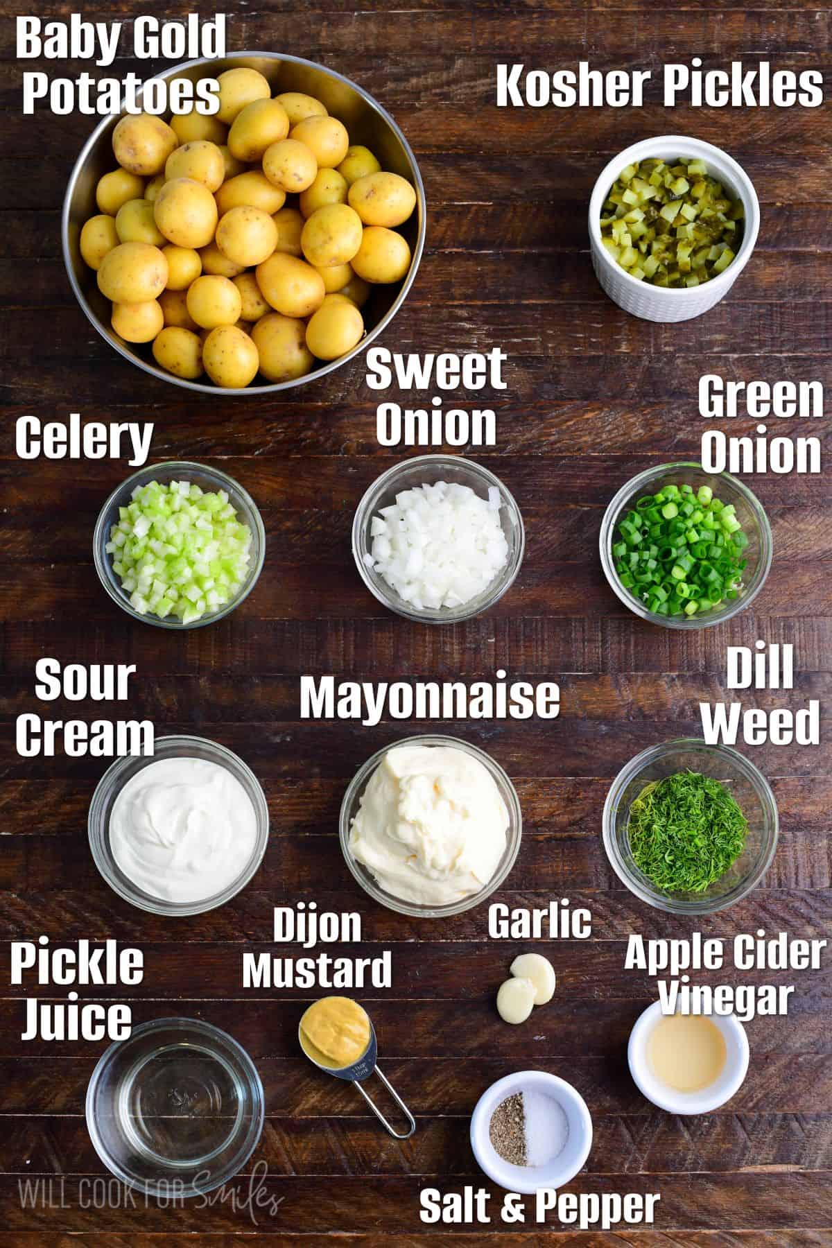 labeled ingredients for dill pickles on a wood surface.