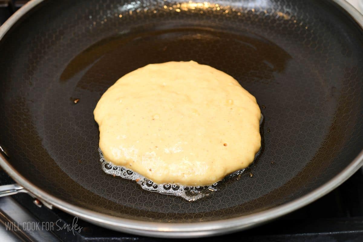Cooking until bubbles begin to form on top and the edges look set.