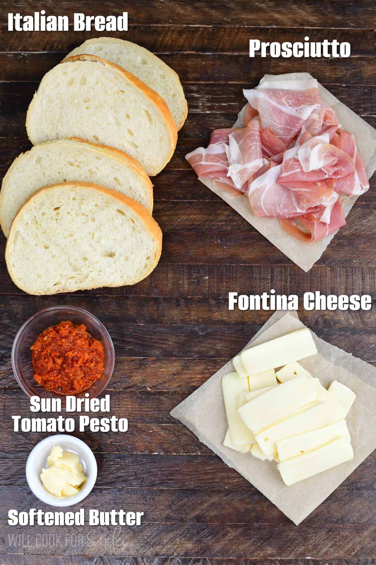 labeled ingredients to make Sun Dried Tomato Pesto Grilled Cheese on the wooden board.