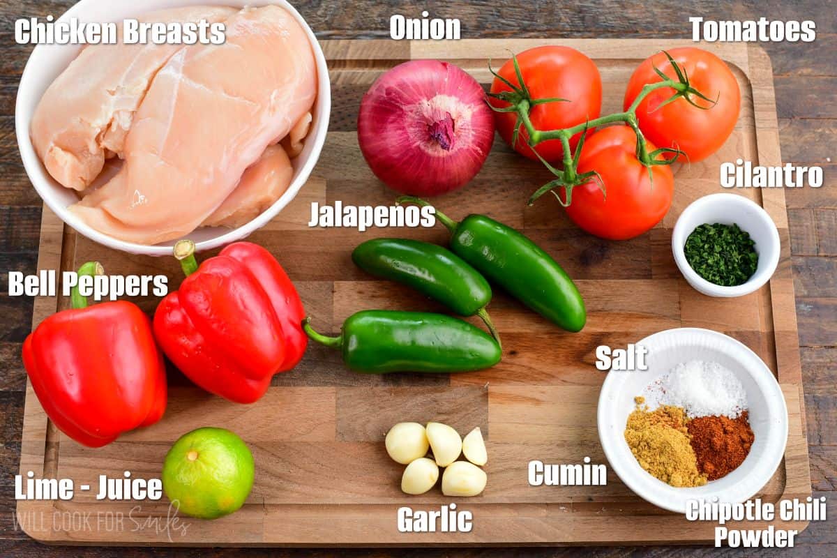 Labeled ingredients for crock pot salsa chicken on a wood surface.