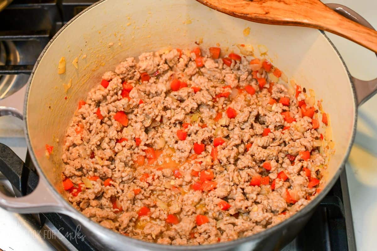 browned ground Italian sausage and veggies cooked in the Dutch oven.