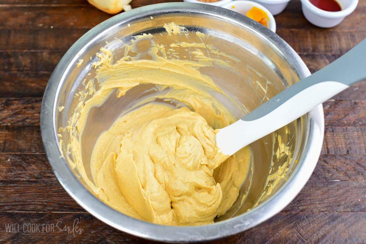 Pumpkin cheesecake filling mixed until smooth and creamy in a bowl for stuffed Hawaiian French toast.